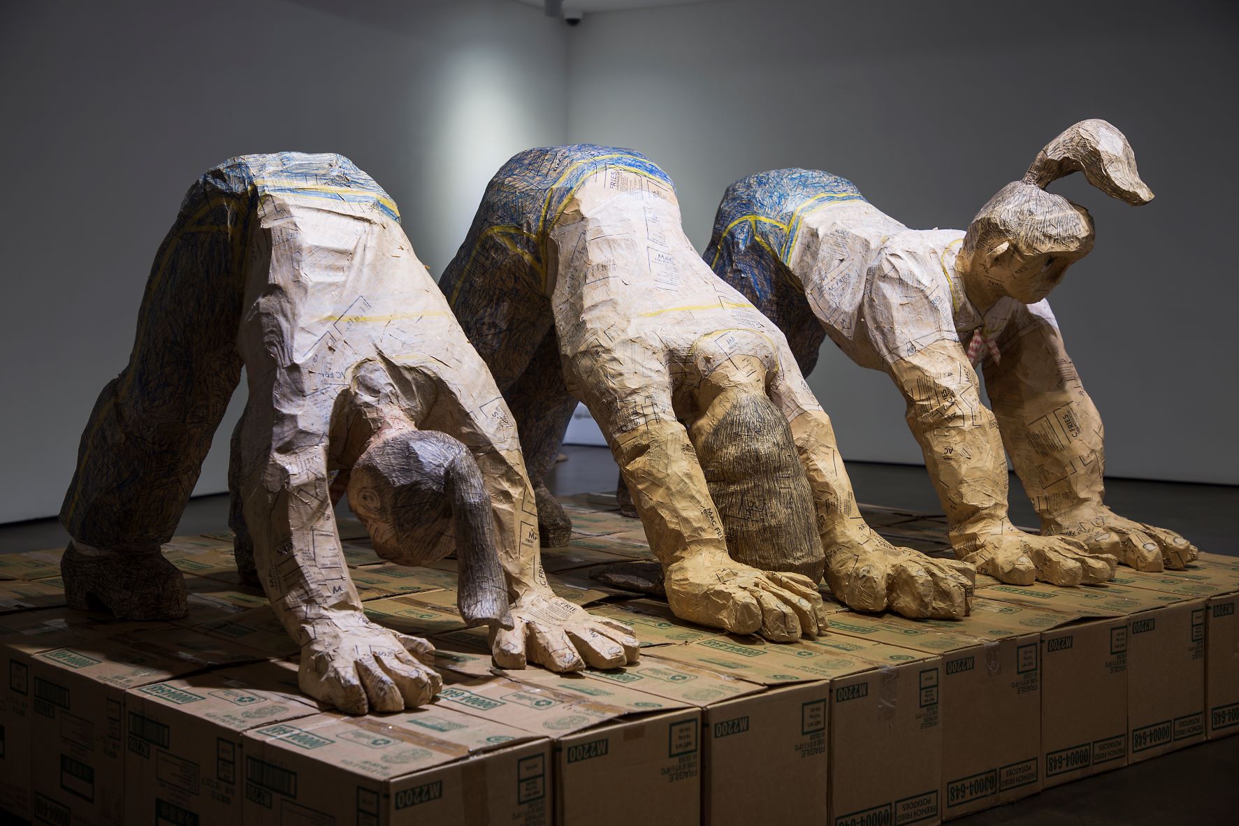 Shin Min, Downward Facing Dog Yoga for Mcjob, 2014, French fries sacks, styrofoam, 308x200x153cm.